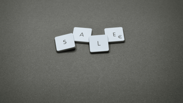 An image with scrabble tiles form the word sale