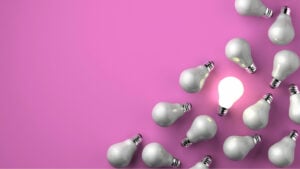 Group of light bulbs with only one lit