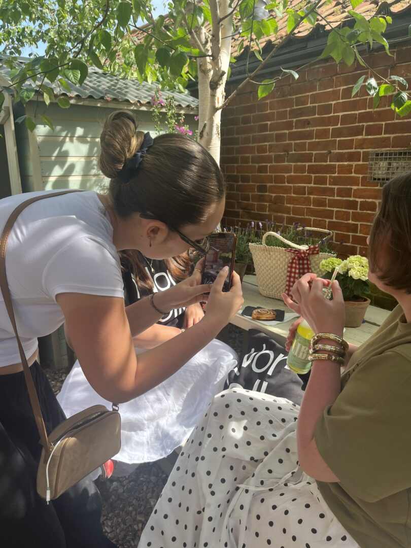Grace from the Yawn team using phone to record social media content
