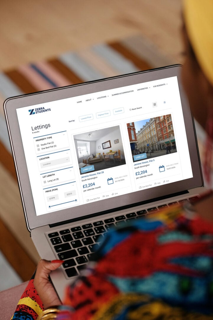 student on laptop browsing student flats on the zebra website