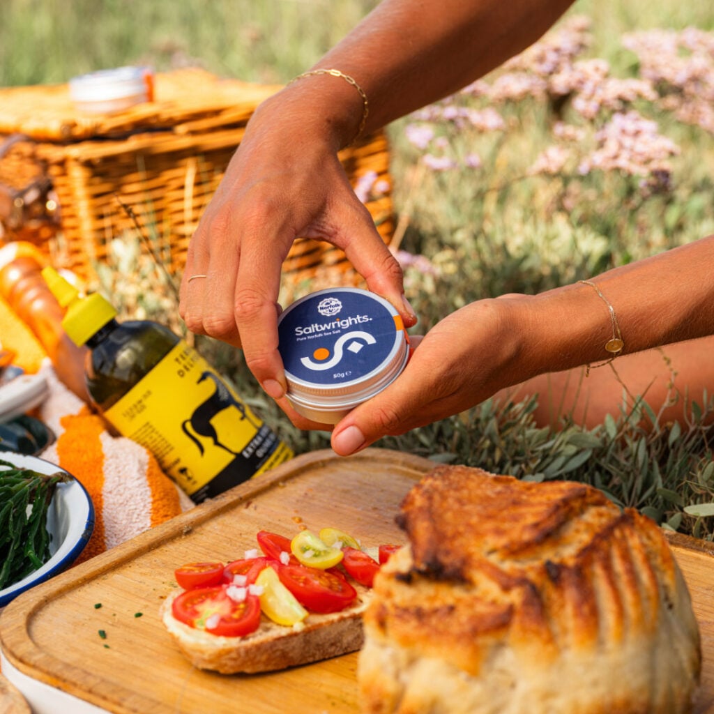 Compact container of Saltwrights on a picnic